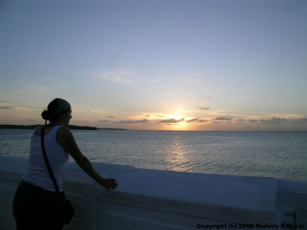 Michaela watches the sunset over the Rio Anil