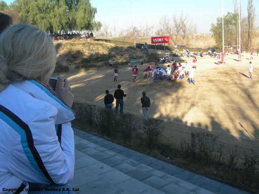 Julia takes a photo of the rugby game